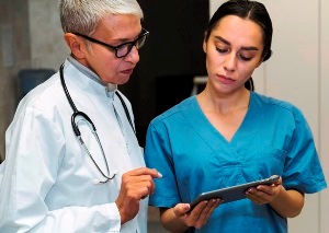 Flagstaff Arizona licensed practical nurse looking over patient file with physician